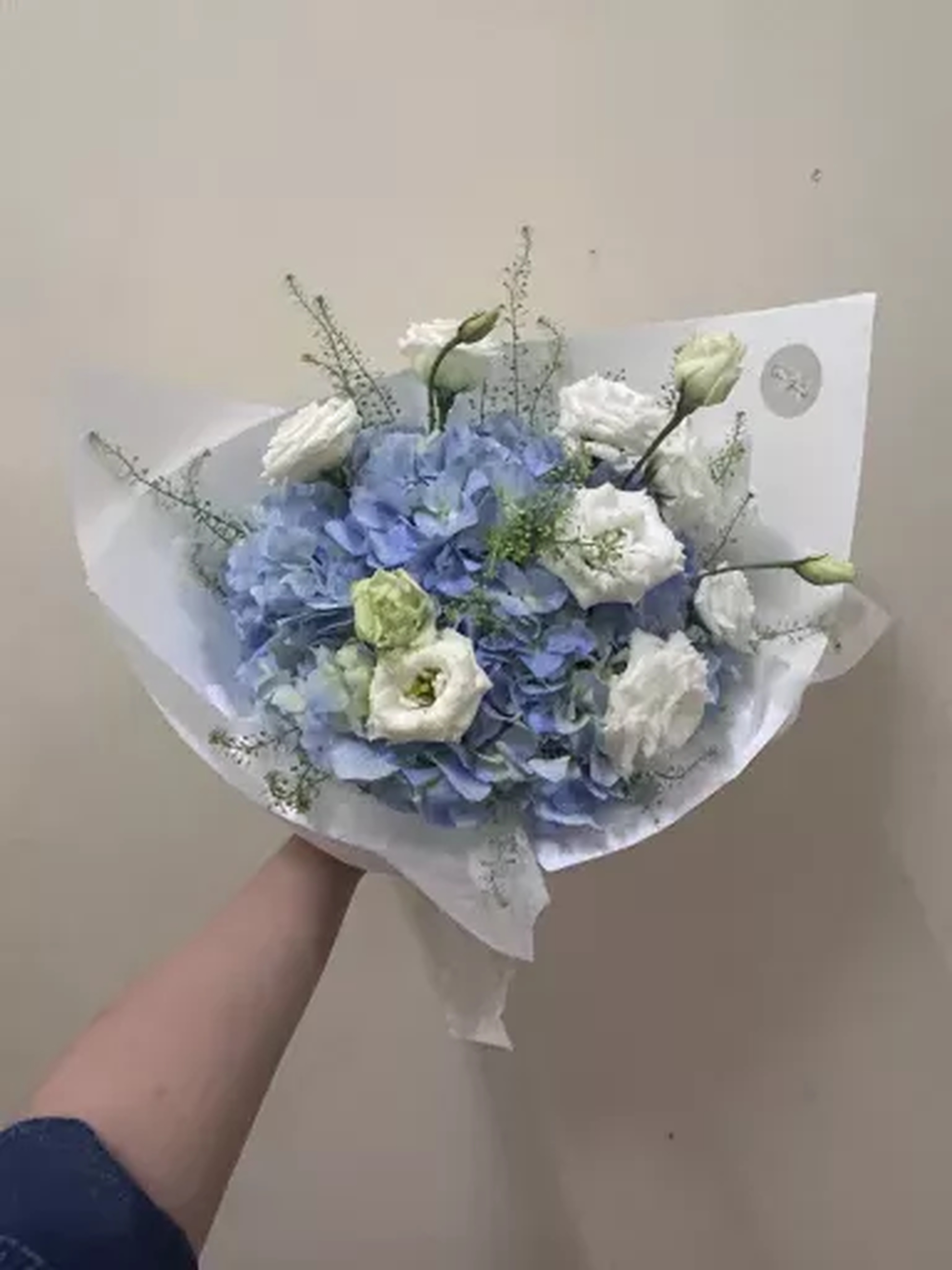 White and pale blue fresh flower bouquet